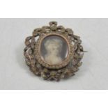 A paste set brooch with portrait miniature of a Georgian lady to centre, testing as silver.