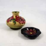 Moorcroft Pottery, Hibiscus pattern squat vase, and a small ashtray dish