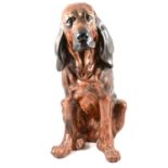 A quantity of mostly Bloodhound dog figures, resign and ceramic, two boxes and a large figure.