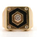 A 750 standard signet ring set with synthetic white stones.