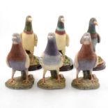 Six pigeon figurines.