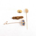 An Etruscan style bar brooch, enamel pin set with a diamond, seed pearl stick pin, cufflink face.