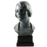 Painted plaster bust, head of a lady, on a rectangular black painted plinth, 50cm.