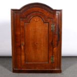 George III walnut hanging corner cupboard,