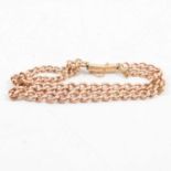 A 9 carat rose gold curb link bracelet.