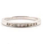 A diamond half eternity ring.