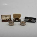 Silver cufflinks, napkin rings, sugar tongs, and other small silver and plated items.