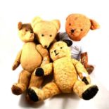 Four large mid-century straw filled teddy bears