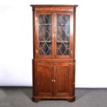 George III oak and mahogany freestanding corner cupboard,
