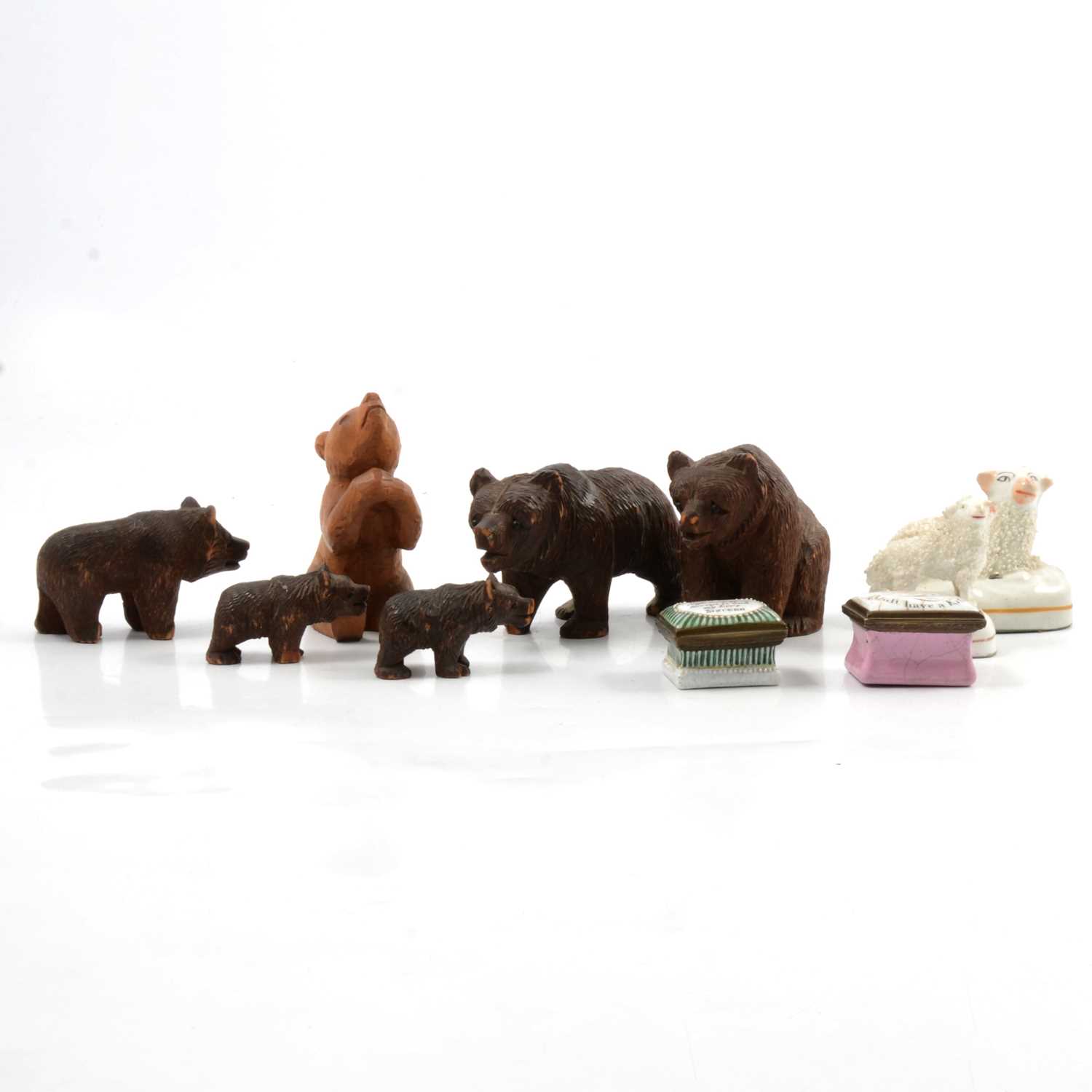 Two small pill boxes, pair of small Staffordshire sheep and five wooden Black Forest Bears.