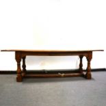 Oak refectory table and eight high back chairs,