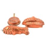 Copper cake moulds of various shapes and designs.