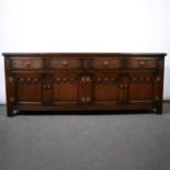 Reproduction oak sideboard base, four frieze drawers over four panelled doors, width 190cm, depth