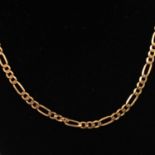 A 9 carat yellow gold figaro fetter and three link necklace and bracelet.