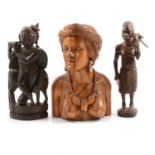 Nine carved wooden African figures and a lidded pot.