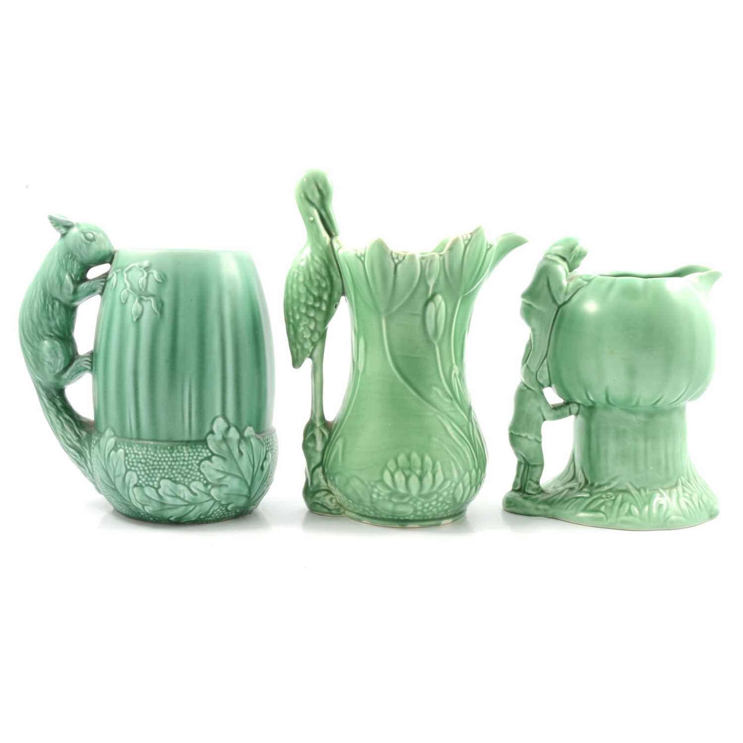 Three green Sylvac jugs.