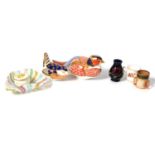 Royal Crown Derby paperweights, miniature Moorcroft, Royal Doulton and Royal Worcester items.