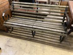 A wrought iron slatted wood garden bench, width 150cm, depth 66cm, height 71cm