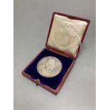 An Edward VII coronation medallion by George William DeSaulle, 55mm, 86g, uncased, GVF