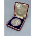 A cased George V silver coronation medal, 1911, by B. Mackennal, 51mm, 85g, GVF