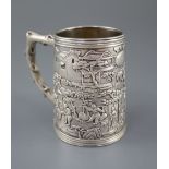 A 19th century Chinese Export silver mug, by Khecheong?, embossed with continuous scene of figures
