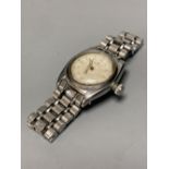 A gentleman's 1930's/1940's? stainless steel mid size Rolex manual wind wrist watch, with signed