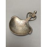 A George V Arts & Crafts planished silver caddy spoon by Albert Edward Jones, Birmingham, 1919,