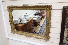 A rectangular gilt gesso wall mirror, width 85cm, height 62cm