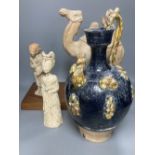 A group of Chinese Tang style pottery figures, tallest 28cm and a partially glazed ewer in sancai
