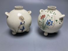 A pair of globular earthenware posy vases, height 10cm