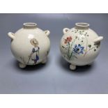 A pair of globular earthenware posy vases, height 10cm