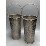 A pair of silver plated embossed champagne buckets, 48cm high including handle