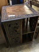 An Indian carved hardwood revolving bookcase, width 53cm, depth 53cm, height 75cm