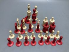 A late 19th century stained natural bone chess set