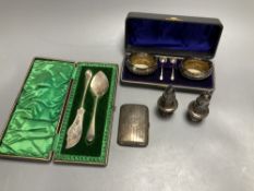 A pair of oval silver salts and spoons (cased), a butter knife and preserve spoon (cased), two