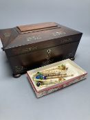 A Victorian mother of pearl-inlaid rosewood sewing box, containing various accessories, lace