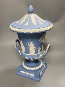 A 20th century Wedgwood light blue jasperware two-handled campagna-shaped urn and cover, decorated