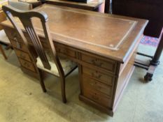 A late Victorian mahogany pedestal desk, width 138cm, depth 71cm, height 74cm together with an Art