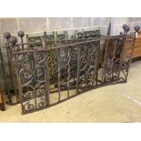 A cast and wrought iron two section balcony railings, total length approx. 385cm and assorted iron
