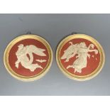 A pair of P. Ipsen Kjobenhavn Eneret relief moulded roundels, depicting night and day, 13cm