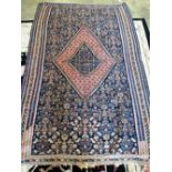 A Senneh Kelim blue ground rug, 19th century, 200 x 130cm