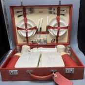 A 1960s Sirram picnic hamper set, in red vinyl case