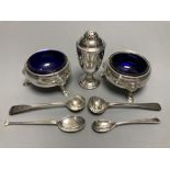 A pair of Georgian silver circular salts, a George III urn-shaped pepper pot and 4 various spoons.