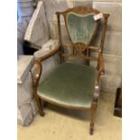 An Edwardian bone and marquetry-inlaid rosewood elbow chair, on square tapered legs with castors,