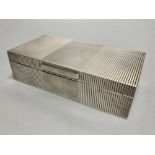 A George VI ribbed silver mounted rectangular cigarette box, Mappin & Webb, London, 1946, 17.8cm.