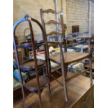 An Arts & Crafts ladder-back rush-seat elbow chair and an Edwardian inlaid mahogany three-tier