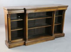 A William IV rosewood dwarf bookcase, with moulded top and four foliate capped columns dividing