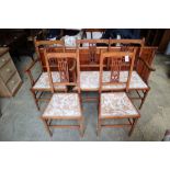 An Edwardian inlaid mahogany four piece part salon suite