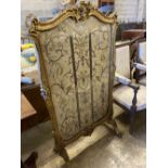 A 19th century Louis XV style giltwood fire screen having embroidered silk panel, width 85cm, height