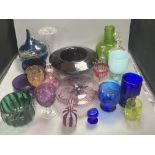 A collection of 18th, 19th and 20th century coloured and clear glassware, including two amethyst